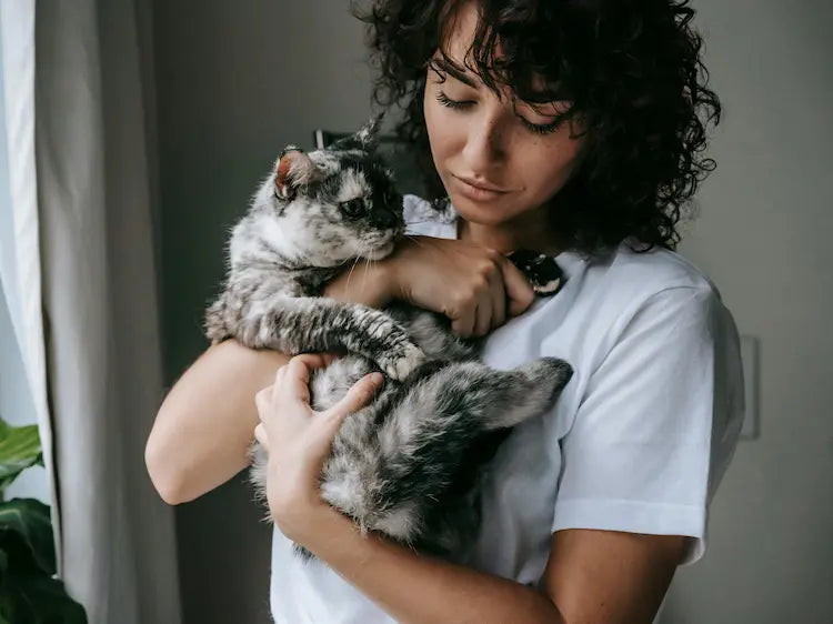 Cat mom and her cat together at home